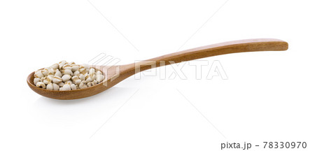 Pile of Job's tears ( Adlay millet) in wood spoon on white background. 78330970