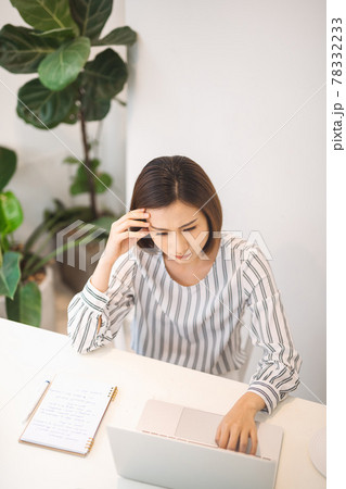 Tired young asian woman feeling stressed because of financial problems 78332233