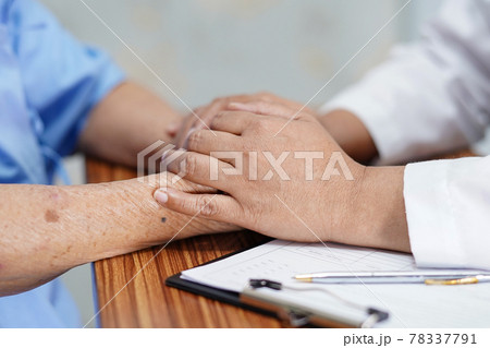 Holding Touching hands Asian senior or elderly old lady woman patient with love, care, helping, encourage and empathy at nursing hospital ward : healthy strong medical concept . 78337791