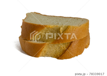 Two slices of white bread on a white background. 78339017