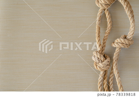 Hemp rope with knots. 78339818