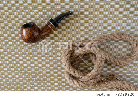 Smoking pipe and hemp rope. 78339820