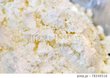 Crumbly cottage cheese on a store counter. Crumbly cottage cheese on a store counter. 78340516