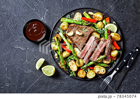beef steak with veggies on a plate beef steak with veggies on a plate 78345074