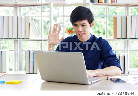 Young asian man looking at camera, recording self-presentation video or sharing professional skills. Happy young smart people filming educational lecture. 78348944