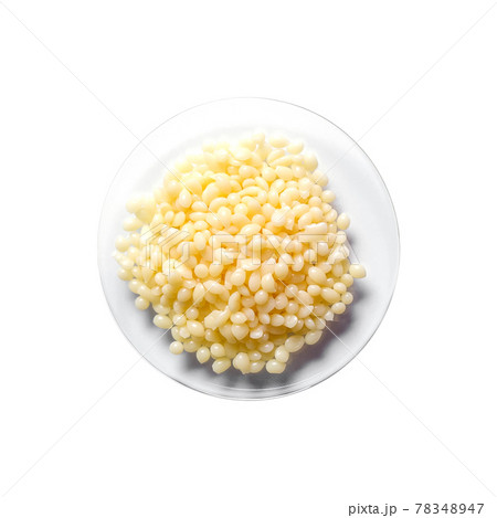 Candelilla Wax SP-75. Chemical ingredient for Cosmetics and Toiletries product on white laboratory table. Top View Candelilla Wax SP-75. Chemical ingredient for Cosmetics and Toiletries product on white laboratory table. Top View 78348947