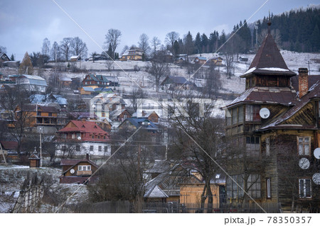 Old Historical Wooden houses in the Carpathian mountains at Winter. Vorokhta, Ukraine Old Historical Wooden houses in the Carpathian mountains at Winter. Vorokhta, Ukraine 78350357