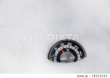Snowed thermometer cold winter weather concept 78352434