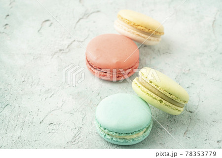 colorful macaroons on green background with copy space 78353779