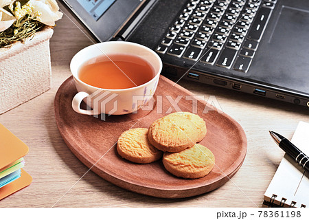 Coconut cookies with tea on the wooden tray Coconut cookies with tea on the wooden tray 78361198