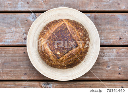 Homemade artisan bread on a round plate 78361460