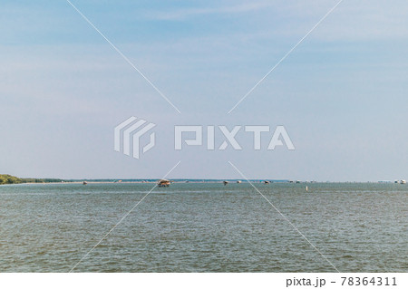 Small hut in the middle of the sea to guard the fishing net area. Small hut in the middle of the sea to guard the fishing net area. 78364311
