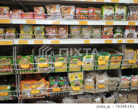 PENANG, MALAYSIA -JANUARY 5, 2021: Selected focused on the spices are sold in commercial packages and displayed on shelves in the supermarket. Sort by brand and type to make it easier to choose.  78366161