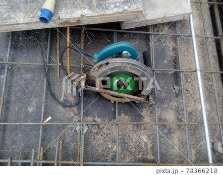 KUALA LUMPUR, MALAYSIA -JUNE 18, 2020: Mobile circular cutter used by the carpenter to cut plywood at the construction site.   78366218