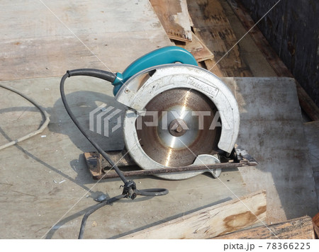 KUALA LUMPUR, MALAYSIA -JUNE 18, 2020: Mobile circular cutter used by the carpenter to cut plywood at the construction site. KUALA LUMPUR, MALAYSIA -JUNE 18, 2020: Mobile circular cutter used by the carpenter to cut plywood at the construction site. 78366225