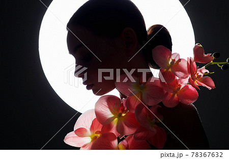 female silhouette with flowers on the background of the moon 78367632