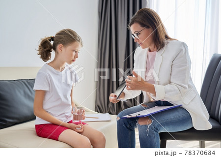 Woman social worker talking to girl. Child psychology, mental health Woman social worker talking to girl. Child psychology, mental health 78370684