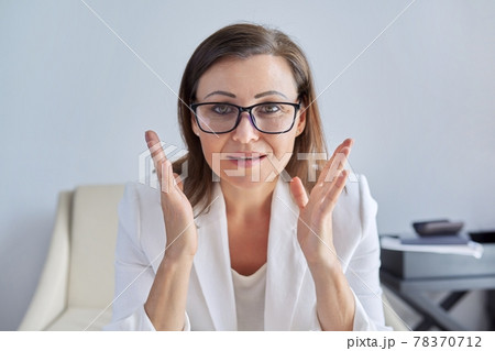Video call, video conference, mature business woman looking at webcam, closeup face 78370712