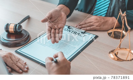 Lawyer or judge has recommend a client sign a legal agreement in the courtroom, Legal Agreement Documents and Business Litigation Forms, scales of justice, law hammer, Litigation and legal services. 78371891