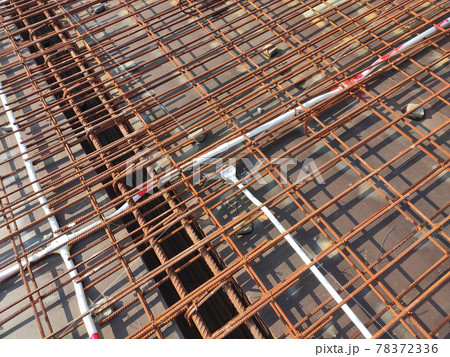 KUALA LUMPUR, MALAYSIA -NOVEMBER 23, 2020: Building floor slab under construction. Construction workers fabricating the timber formwork and installing the steel reinforcement bar. KUALA LUMPUR, MALAYSIA -NOVEMBER 23, 2020: Building floor slab under construction. Construction workers fabricating the timber formwork and installing the steel reinforcement bar. 78372336