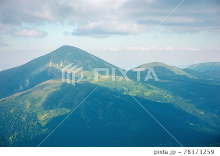 carpathian mountain landscape in summer. hoverla peak and chornohora ridge in the distance. cloudy afternoon weather 78373259