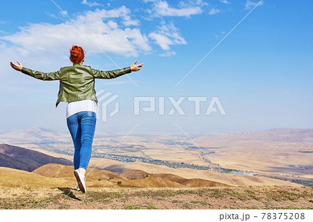 Beauty woman outdoors enjoying nature. 78375208