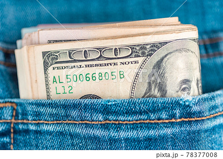 Dollars in jeans.Macro shot of trendy jeans with US dollar bills in a pocket. Financial concept. Dollars in jeans.Macro shot of trendy jeans with US dollar bills in a pocket. Financial concept. 78377008