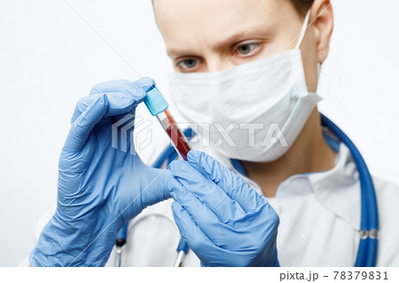 Doctor holding blood test tube 78379831