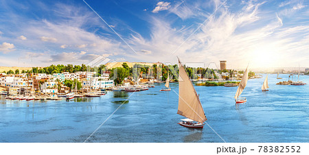 Aswan city in Egypt, beautiful scenery of the Nile river with felucca boats Aswan city in Egypt, beautiful scenery of the Nile river with felucca boats 78382552