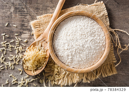 White rice flour in a bowl on wood 78384329