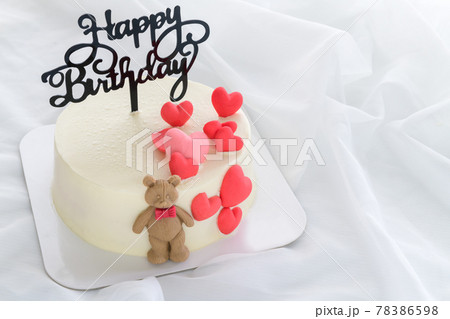 Happy Birth day Fresh butter cream cake decorated with small hearts and a teddy bear Happy Birth day Fresh butter cream cake decorated with small hearts and a teddy bear 78386598