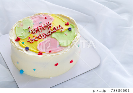 Pastel color butter cream cake on white cloth background, minimal cake concept Pastel color butter cream cake on white cloth background, minimal cake concept 78386601