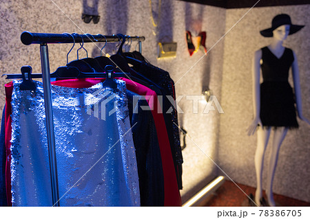 Choice of fashion clothes of different colors on wooden hangers. Choice of fashion clothes of different colors on wooden hangers. 78386705