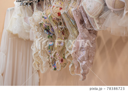 Row of bras hanging in lingerie store. Row of bras hanging in lingerie store. 78386723