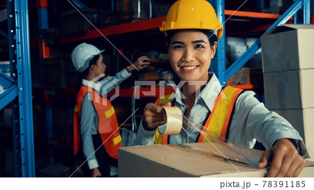 Portrait of young Asian woman warehouse worker smiling in the storehouse Portrait of young Asian woman warehouse worker smiling in the storehouse 78391185