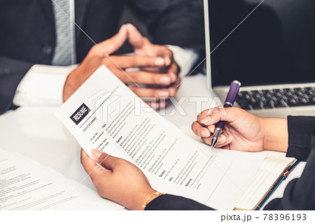 Human resources department manager reads CV resume Human resources department manager reads CV resume 78396193