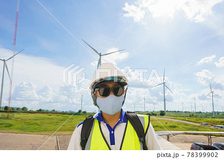 engineers male checking wind turbines. Renewable energy technology and sustainability. Alternative energy for future 78399902