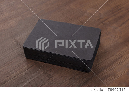 Black business cards mockup on a rustic background 78402515