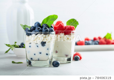 Curd dessert with berries and mint. Curd dessert with berries and mint. 78406319