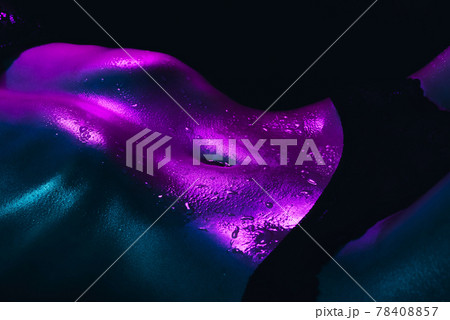 Beautiful female wet tummy with a slender waist in drops of water and sweat on the skin Beautiful female wet tummy with a slender waist in drops of water and sweat on the skin 78408857