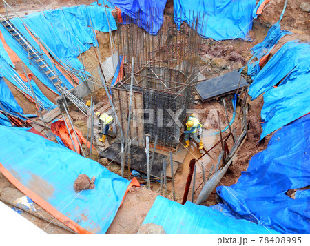 SELANGOR, MALAYSIA - JANUARY 15, 2017: Foundation work include the building piling works and pile cap construction at the construction site. Heavy construction work with full awareness about workers s SELANGOR, MALAYSIA - JANUARY 15, 2017: Foundation work include the building piling works and pile cap construction at the construction site. Heavy construction work with full awareness about workers s 78408995