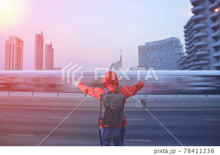 Back view of a young asian man with traveling backpacker in city road outdoor in Bangkok, Thailand. The concept of travel is discovering new places. Back view of a young asian man with traveling backpacker in city road outdoor in Bangkok, Thailand. The concept of travel is discovering new places. 78411236