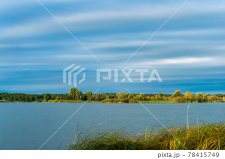 Lake of the Woods. A natural body of water in summer. Spring on the river. Lake of the Woods. A natural body of water in summer. Spring on the river. 78415749
