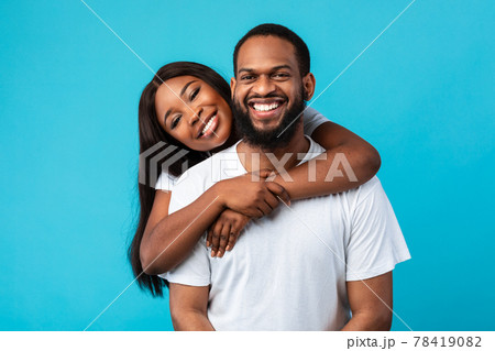 African American woman cuddling with her man African American woman cuddling with her man 78419082