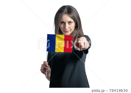 Happy young white woman holding flag of Romania and points forward in front of him isolated on a white background 78419630