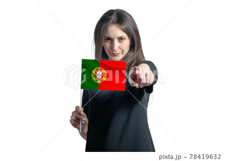 Happy young white woman holding flag of Portugal and points forward in front of him isolated on a white background Happy young white woman holding flag of Portugal and points forward in front of him isolated on a white background 78419632