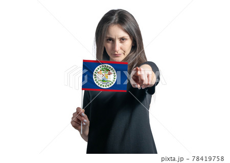 Happy young white woman holding flag of Belize and points forward in front of him isolated on a white background Happy young white woman holding flag of Belize and points forward in front of him isolated on a white background 78419758