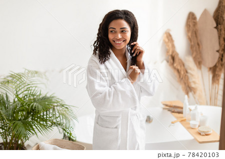 African American Lady Touching Hair After Shower Posing In Bathroom African American Lady Touching Hair After Shower Posing In Bathroom 78420103