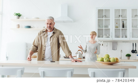 Angry annoyed wife blames husband, marriage problems at home. Covid-19 pandemic and bad relationships 78420349