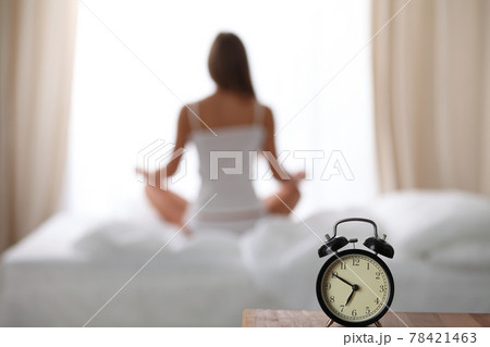 Woman stretching in bed after wake up, back view, entering a day happy and relaxed after good night sleep. Sweet dreams, good morning, new day, weekend, holidays concept Woman stretching in bed after wake up, back view, entering a day happy and relaxed after good night sleep. Sweet dreams, good morning, new day, weekend, holidays concept 78421463
